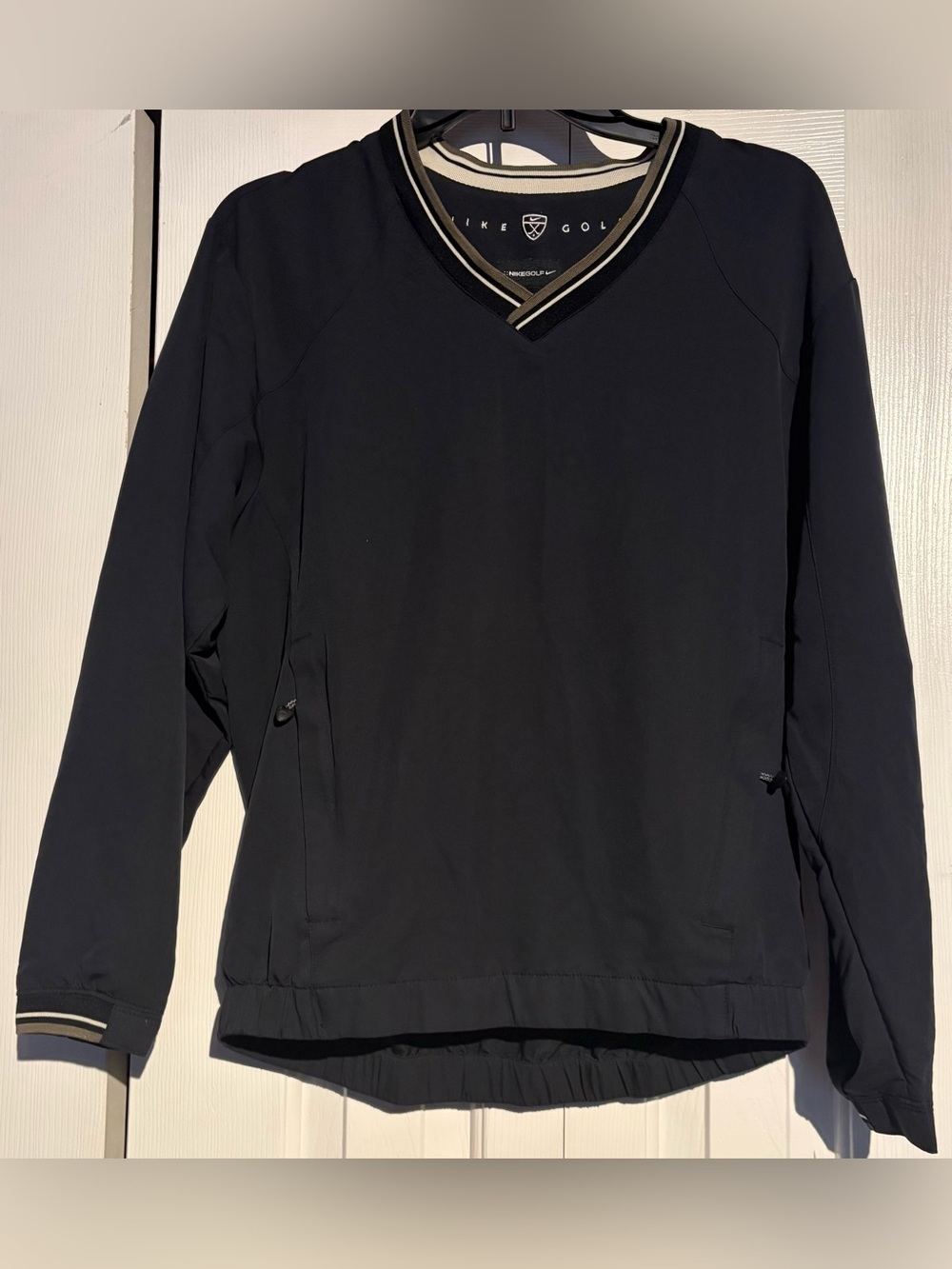 Nike Golf women's V-Neck Black Pullover with Striped Trim and whembroidered logo